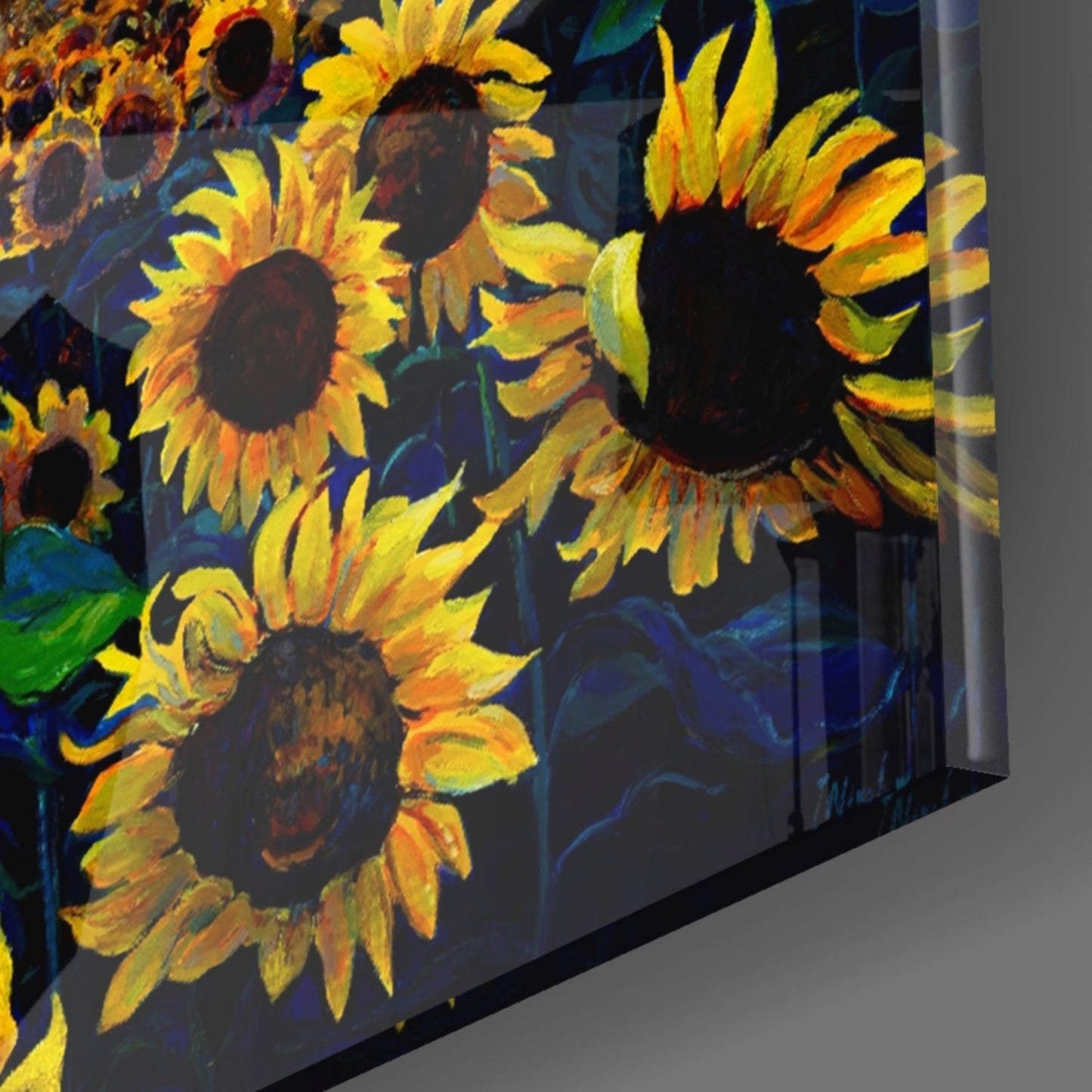 Angled side view of glass wall art displaying vibrant yellow and orange sunflowers against a deep blue background.