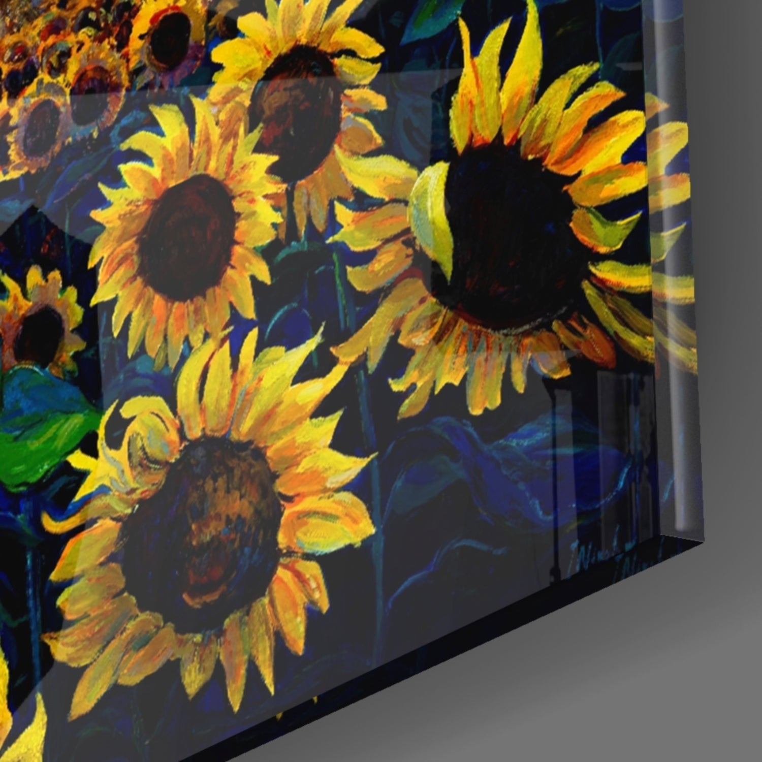 Angled side view of glass wall art displaying vibrant yellow and orange sunflowers against a deep blue background.