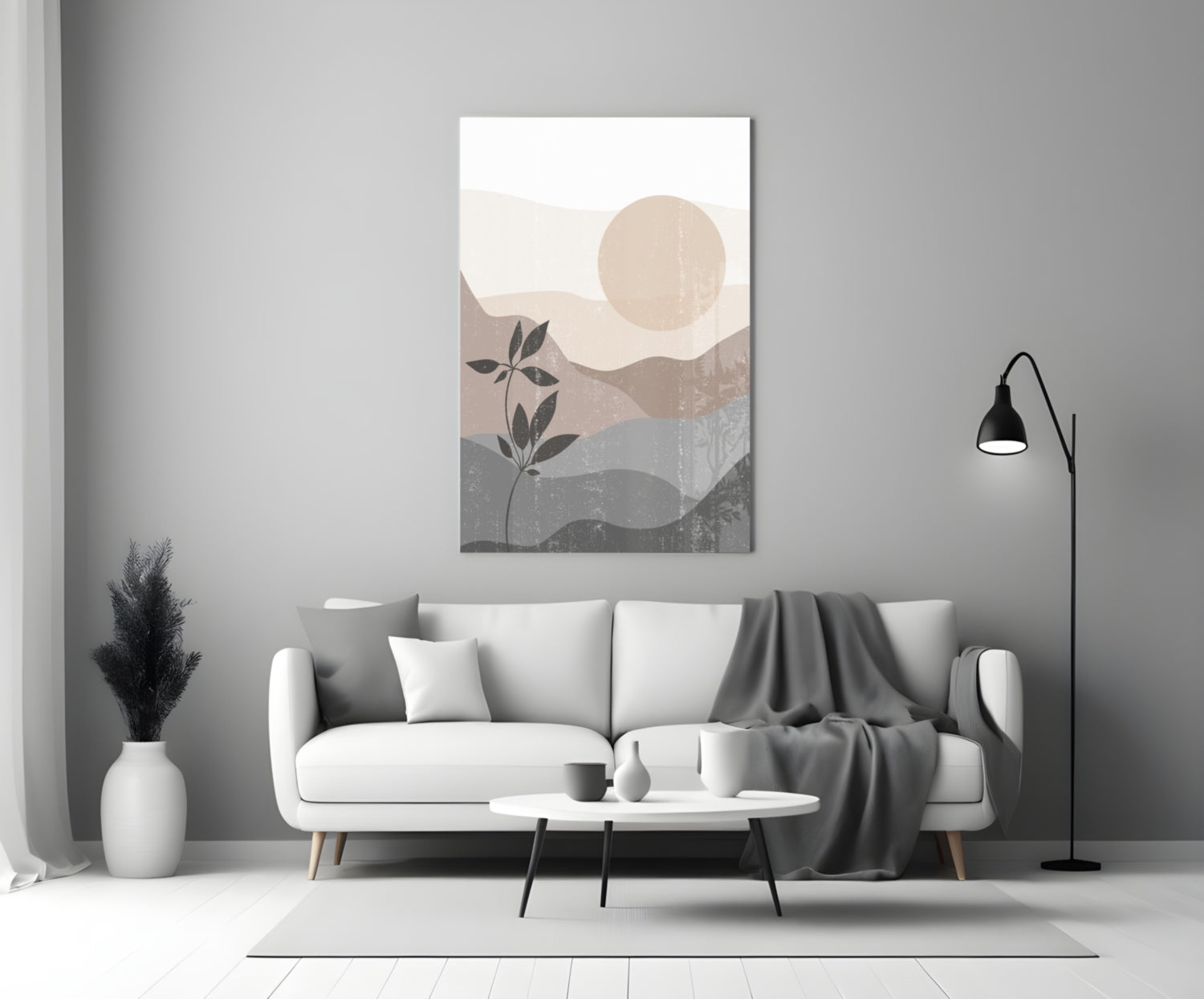 Small Leaves Glass Wall Art displayed above a white sofa in a minimalist living room with neutral tones and botanical motifs.