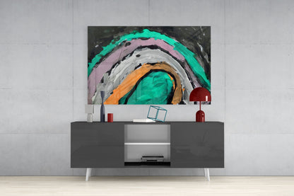 Modern living room with gray media console displaying abstract glass wall art featuring concentric circles in turquoise, pink, orange, and white.