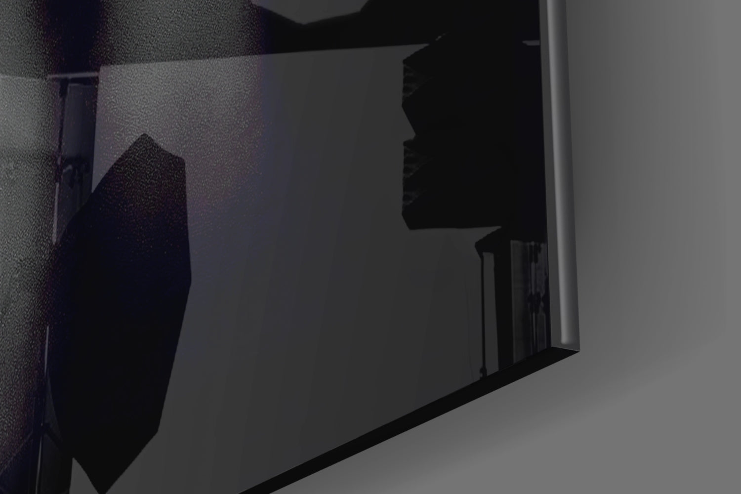 Close-up angled view of silver woman profile glass wall art mounted on textured wall, showing silhouette detail.