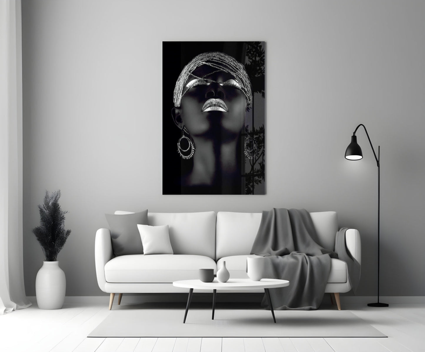 Silver Woman Glass Wall Art displayed above a white sofa in a modern living room setting.