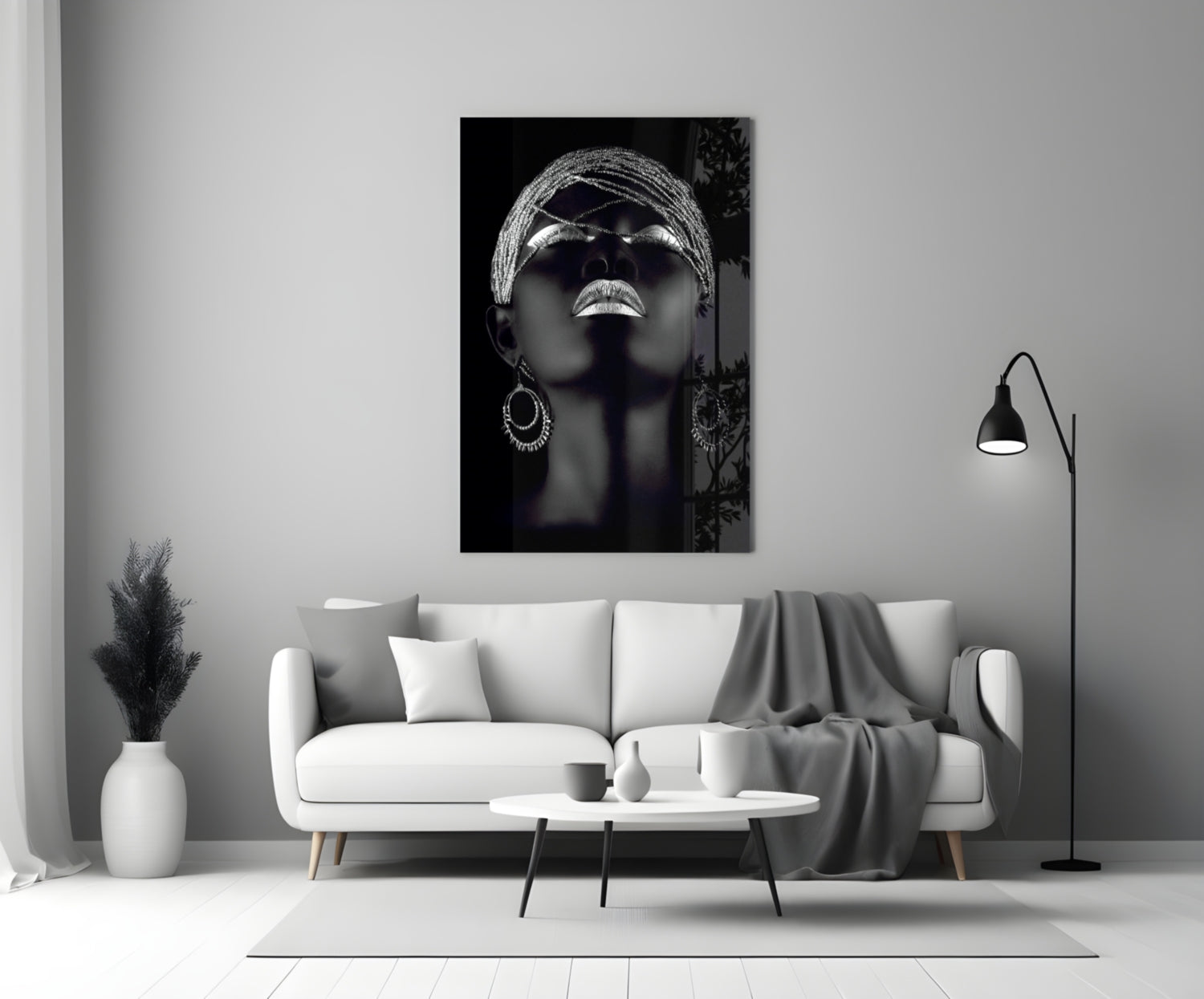 Silver Woman Glass Wall Art displayed above a white sofa in a modern living room setting.