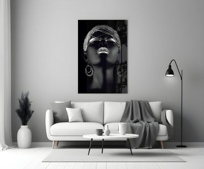 Silver Woman Glass Wall Art displayed above a white sofa in a modern living room setting.