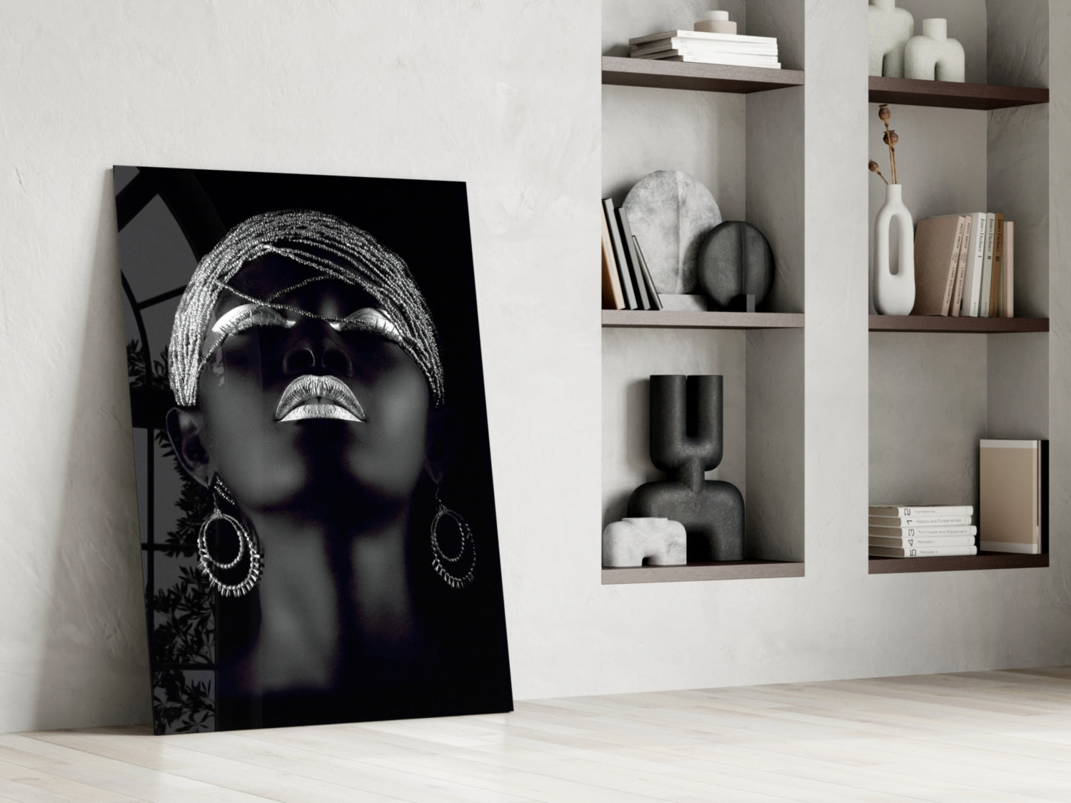 Black and white glass portrait of woman wearing sunglasses and hoop earrings, leaning against white wall with wooden shelves.