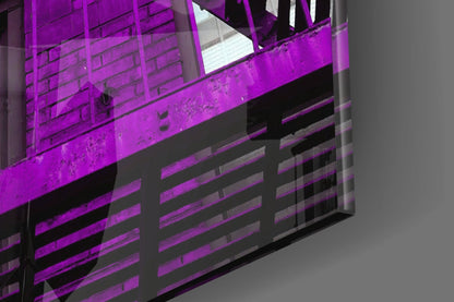Purple glass wall art with horizontal striped pattern mounted on dark architectural structure, photographed at angled perspective.