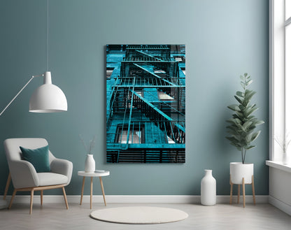 Blue Stairs Glass Wall Art displayed on pale blue wall above white chair in minimalist interior setting.