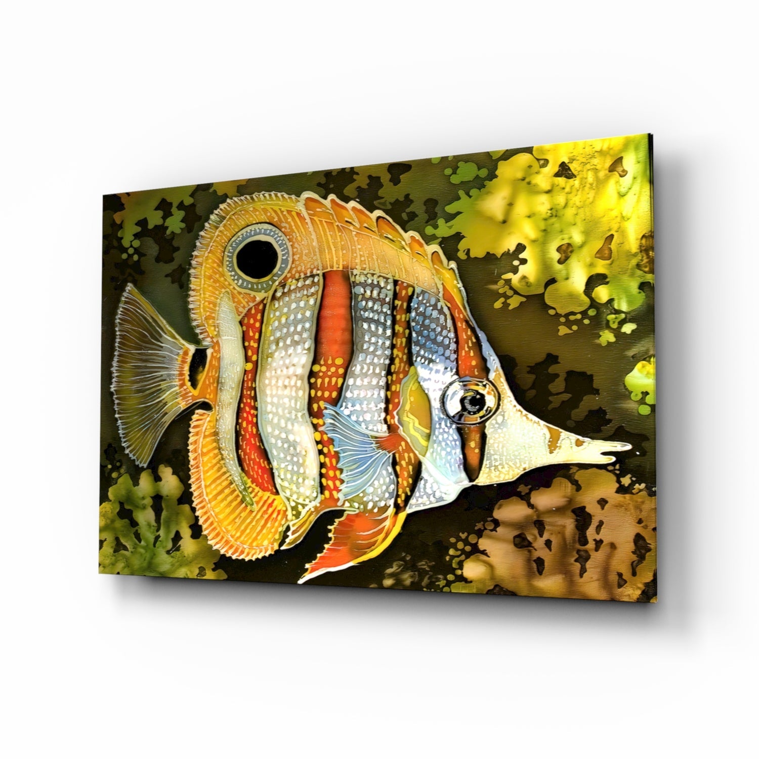 Angled view of a colorful glass wall art featuring an orange and white striped fish with detailed fin patterns against a dark background with coral motifs.