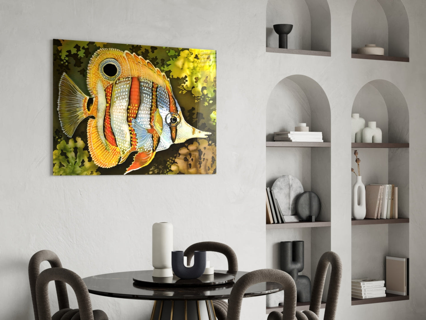 Colorful orange and white striped fish glass wall art hanging above a round black dining table in a modern interior.