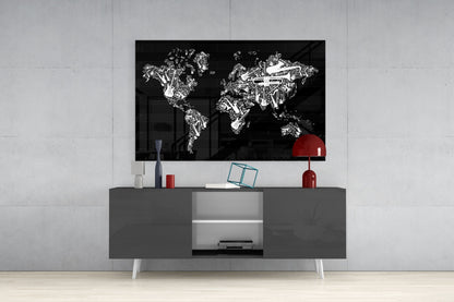 Black glass wall art featuring white line-drawn musical instruments forming a world map, mounted above gray media console with red lamp and decorative items.