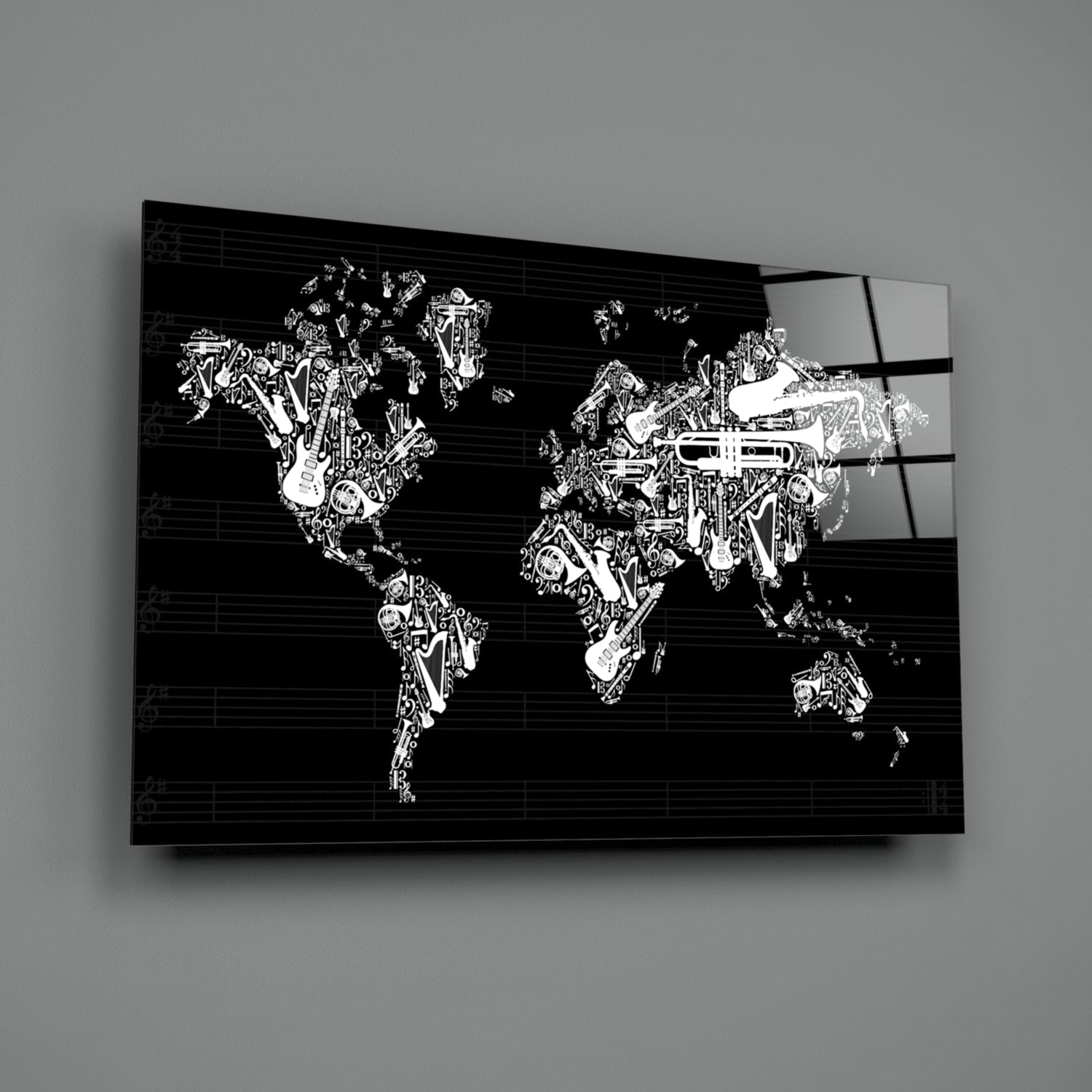 Black and white glass wall art displaying world map filled with musical instruments and staff lines, angled perspective view.