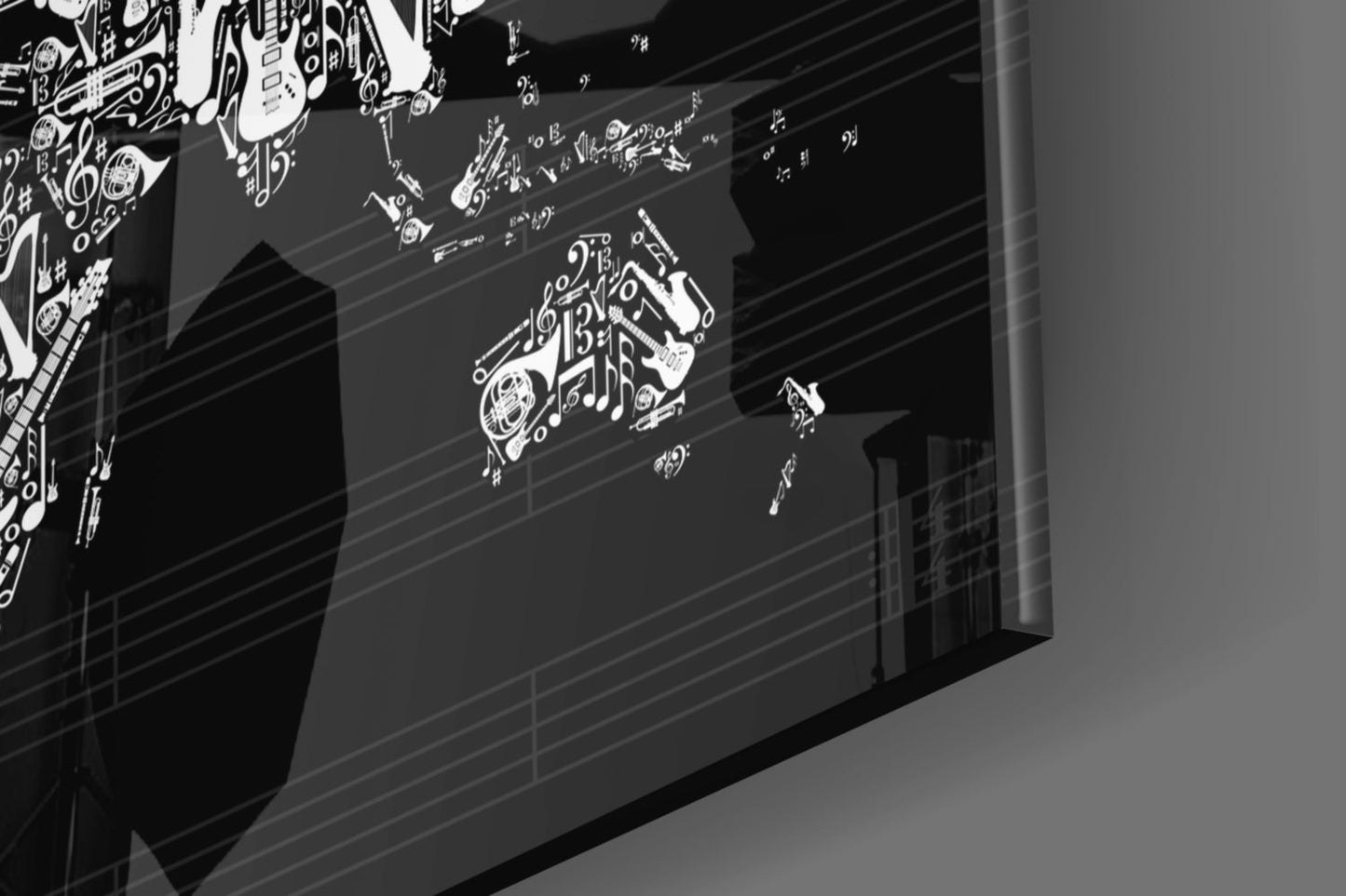 Black and white glass wall art displaying musical instruments and notes in an angled 3D perspective view.