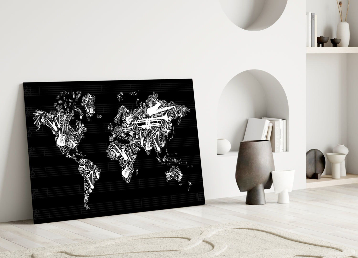 Black glass wall art featuring white musical instruments forming a world map, leaning against white wall in minimalist interior setting.