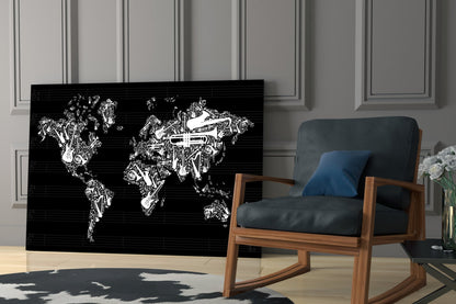 Black glass wall art featuring white line-drawn musical instruments forming world map shapes, displayed in modern living room with wooden chair.