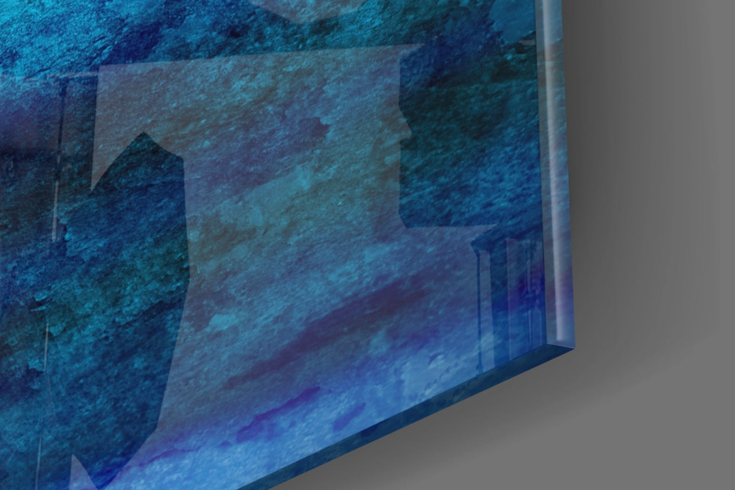 Angled perspective view of blue glass wall art with layered turquoise and deep blue tones showing textured surface detail.