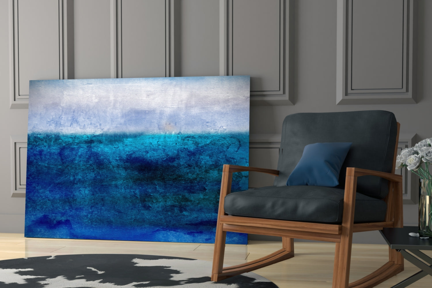 Blue ombre glass wall art displayed in modern living room setting next to wooden chair and paneled wall.