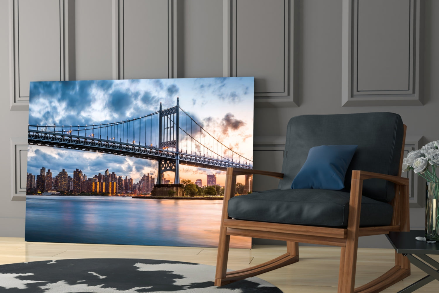 Glass wall art displaying Queensboro Bridge at sunset with Manhattan skyline, installed in modern living room beside wooden chair.