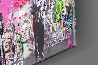 Two angled glass panels displaying pop art style portraits with bright pink, green, and blue overlays on gray background.
