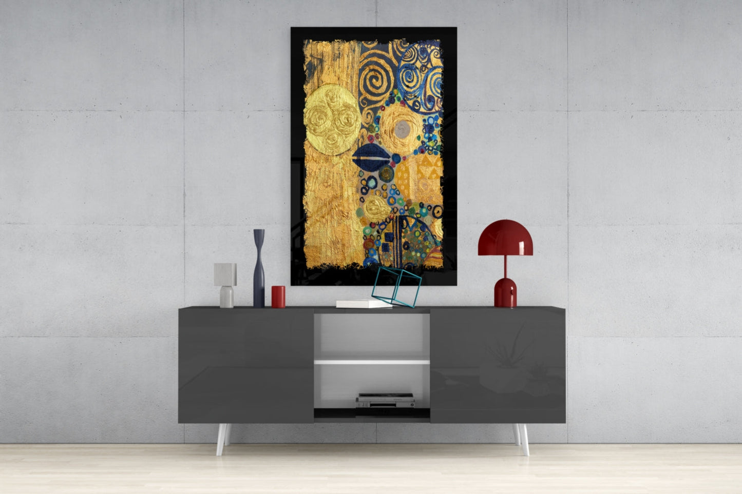 Gold abstract glass wall art with blue and teal spiral patterns displayed above a gray media console in a modern interior setting.