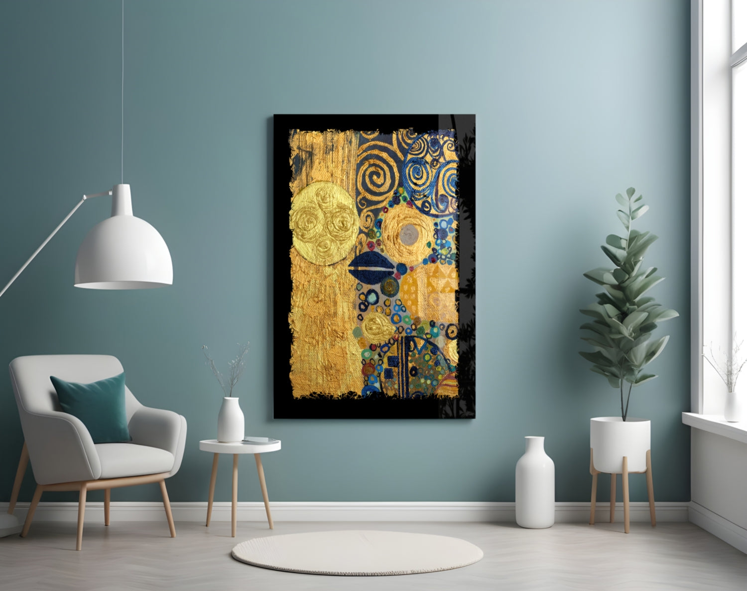Gold abstract glass wall art with blue spirals and celestial circles displayed above a white armchair in a teal room.