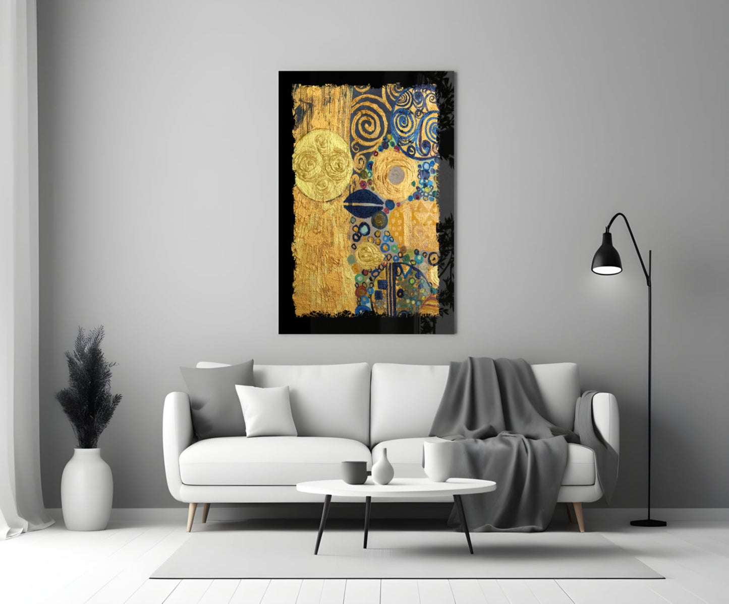 Gold abstract glass wall art with blue and teal geometric patterns displayed above white sofa in modern living room.
