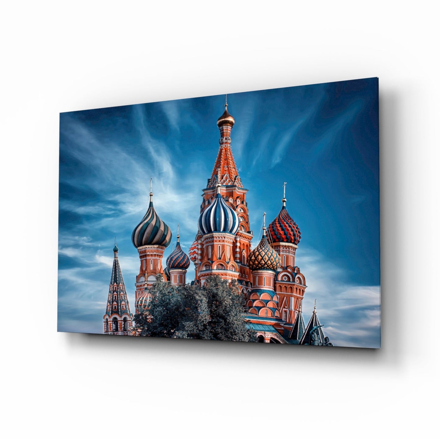 St. Basil's Cathedral glass wall art panel displayed at an angle, showing the colorful domes and ornate red brick architecture against a blue sky.