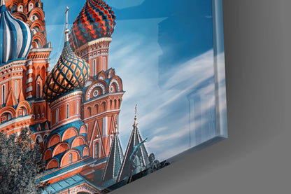 Printed glass panel displaying colorful St. Basil's Cathedral with ornate domes and spires against blue sky, mounted on gray wall.