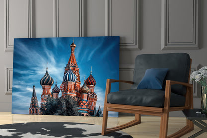 St. Basil's Cathedral glass wall art displayed in a modern living room next to a wooden chair with black cushioning.