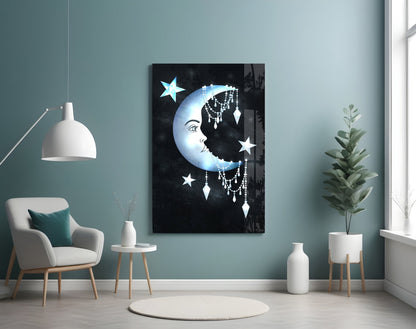 Moon Star Glass Wall Art displayed on teal wall above white chair in modern living room setting with plants and pendant lamp.