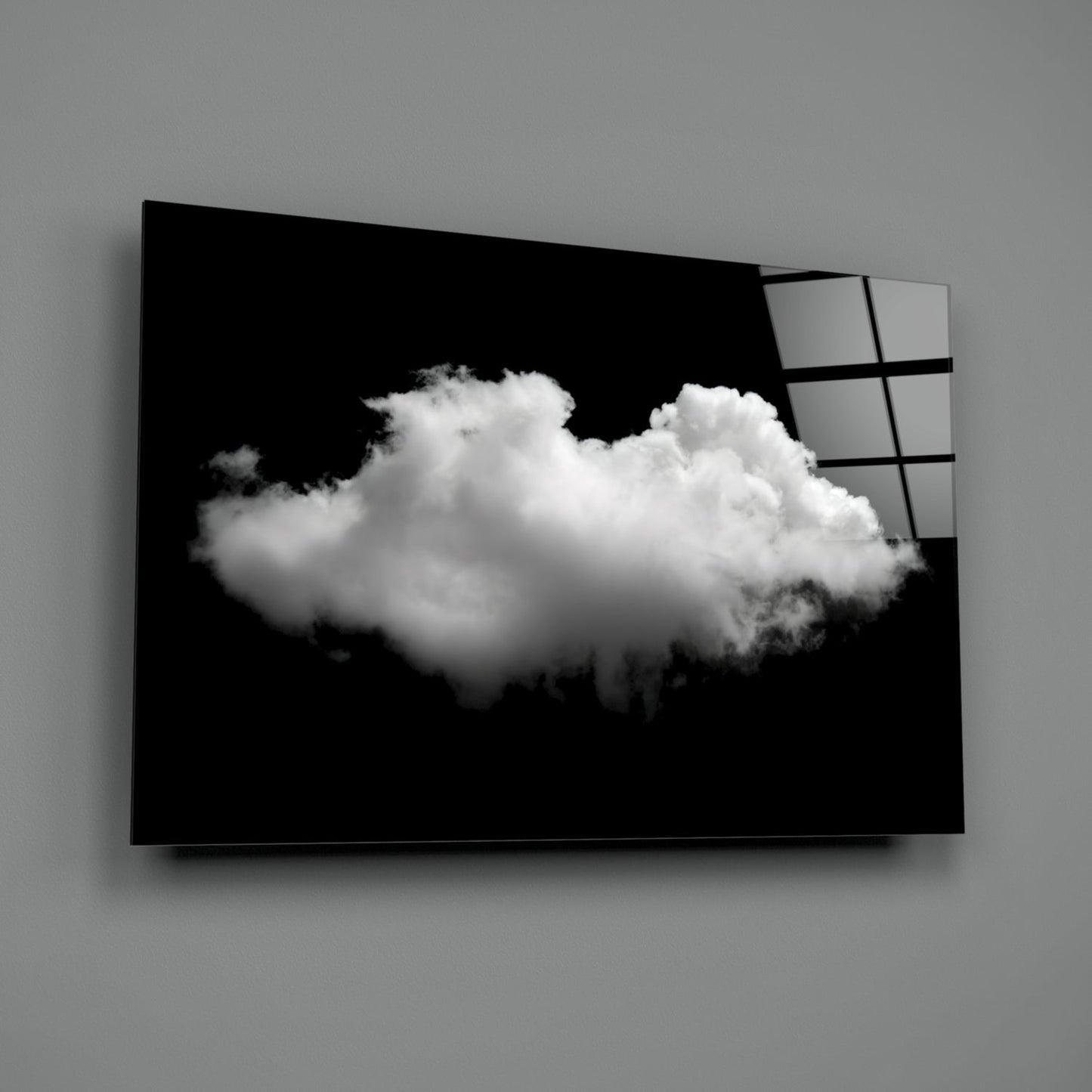 Black and white cloud glass wall art mounted on gray wall, displaying fluffy white cloud against black background with gridded glass panel visible on right edge.