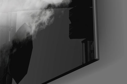 Black and white landscape photograph printed on frosted glass panel mounted on white wall, showing misty mountains.