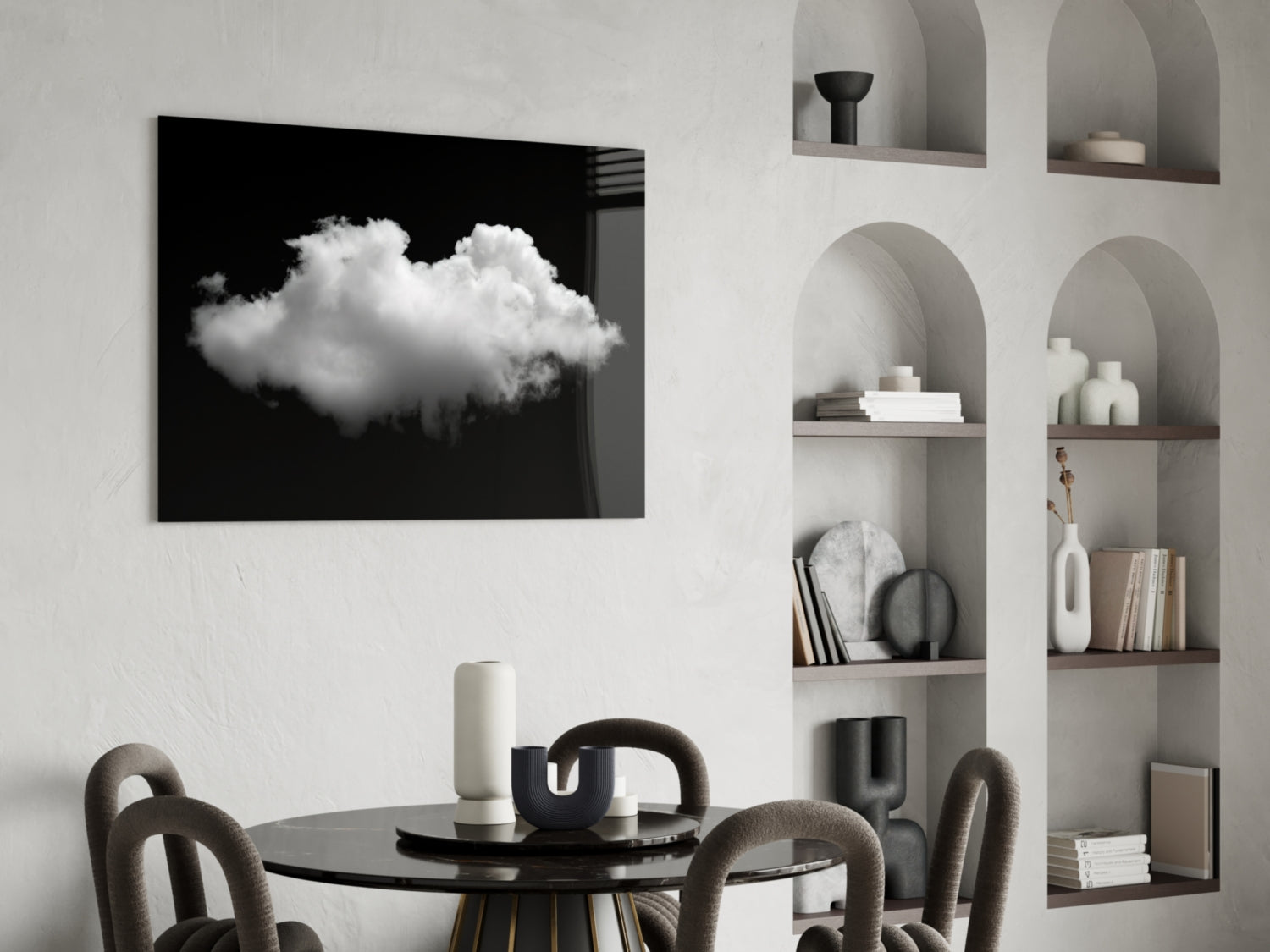 Black and white cloud glass wall art displayed above a dining table with arched shelving in a minimalist interior.