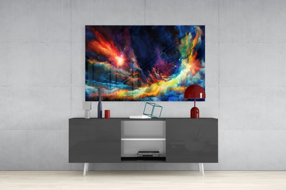 Vibrant multicolored abstract glass art displaying fiery reds, blues, and yellows mounted above a modern gray media console.