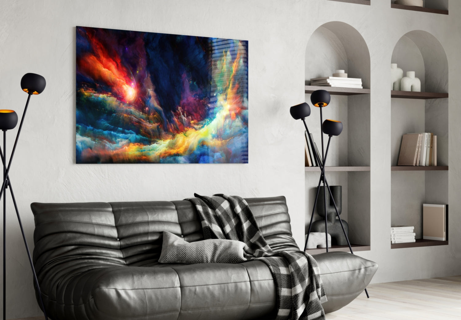 Colorful space glass wall art featuring vibrant orange, blue, and yellow cosmic imagery displayed above a black leather sofa in a modern living room.