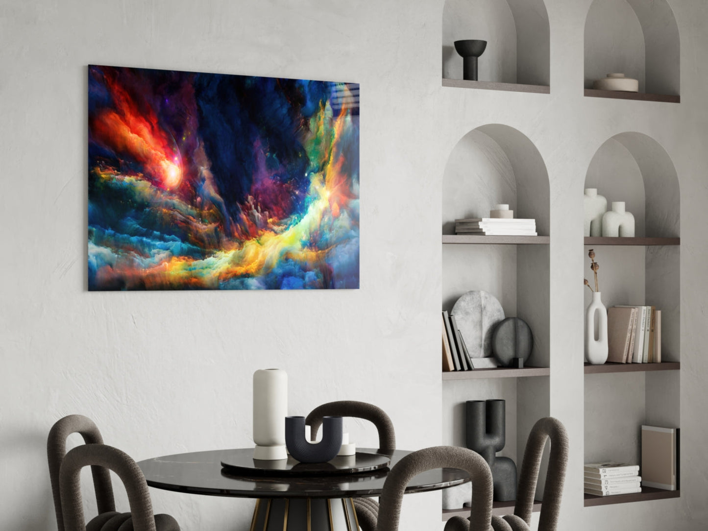 Vibrant abstract glass wall art with orange, blue, and yellow cosmic swirls displayed above a modern dining table.