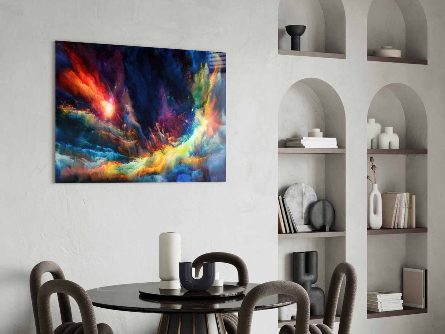 Vibrant abstract glass wall art with orange, blue, and yellow cosmic swirls displayed above a modern dining table.
