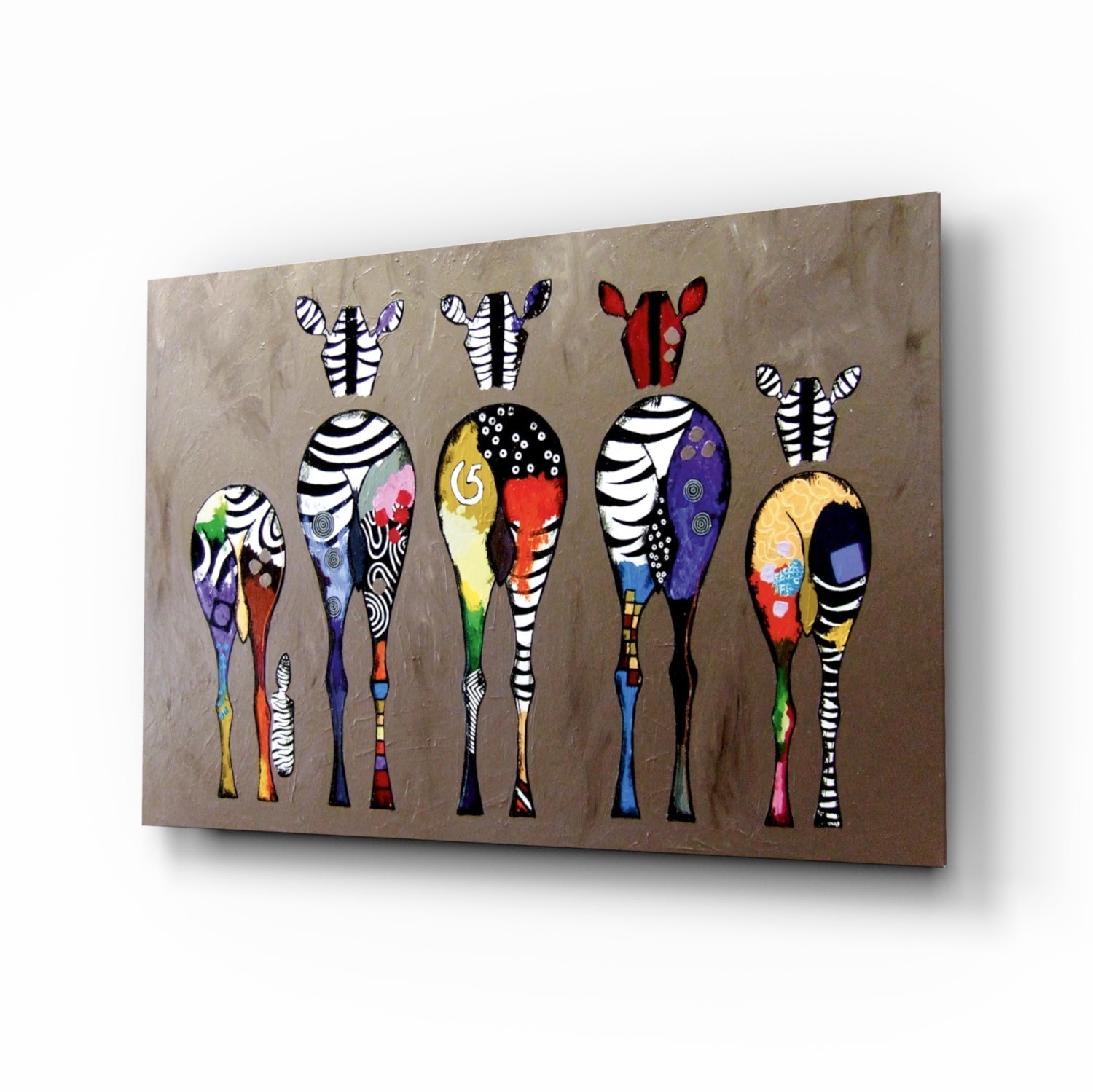 Five stylized zebras with striped legs and colorful patterned bodies displayed on a taupe textured glass panel, angled perspective view.