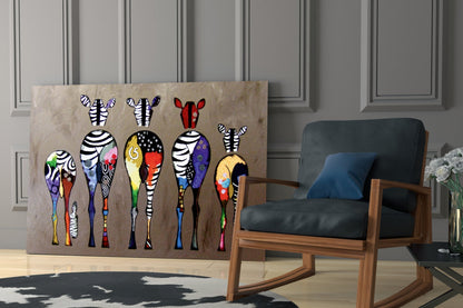Colorful zebra glass wall art displayed in a modern living room next to a wooden chair with black cushions.