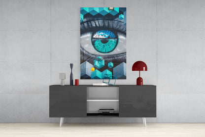 Turquoise eye glass art displayed on gray media console with decorative items in modern living room setting.