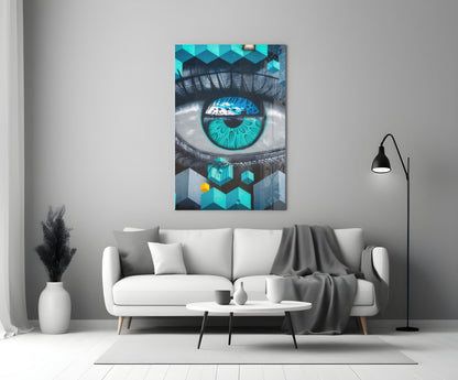 Turquoise and black eye artwork displayed on white living room wall above cream sofa with floor lamp.