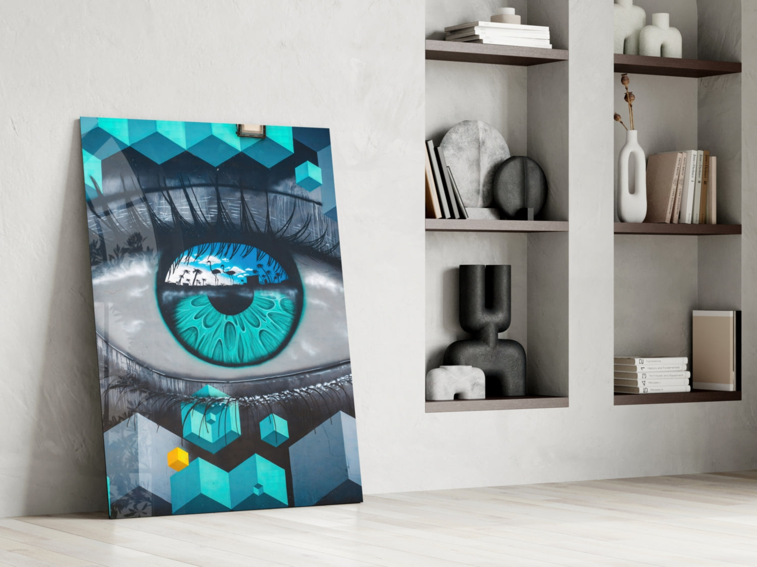 Modern living room interior with turquoise and black eye artwork leaning against white wall beside built-in shelving.