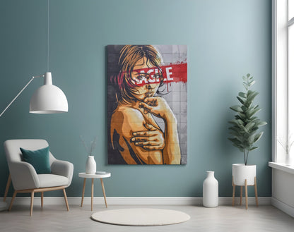 Pop art style glass wall art depicting a woman's portrait in orange and black with red "RAGE" text overlay, displayed in a modern living room setting.