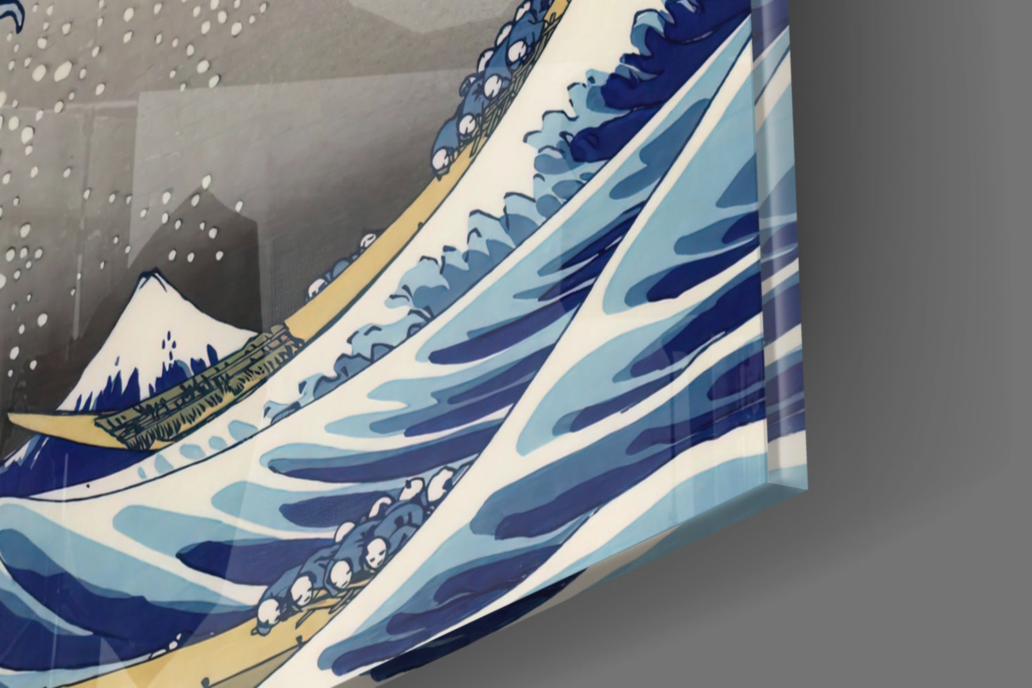 Angled close-up of layered glass artwork showing blue and white wave patterns with wooden boat detail and gold trim.