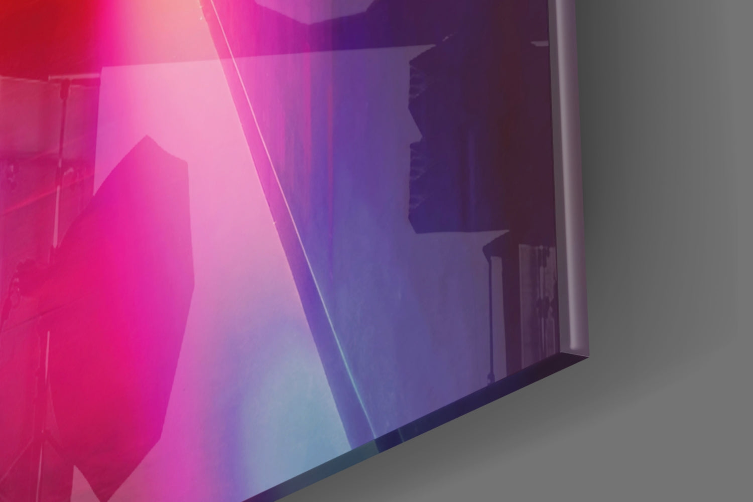 Angled view of colored glass wall art with vibrant pink, purple, and blue gradient transitioning across translucent panels against white wall.
