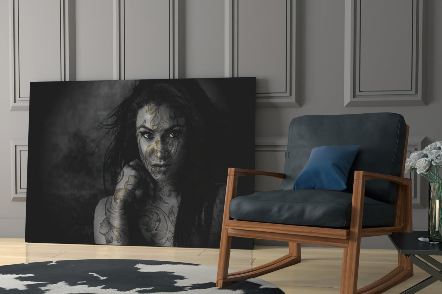 Tattooed woman glass wall art leaning against paneled wall beside wooden chair in modern interior setting.