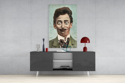 Vintage portrait of a mustachioed gentleman in green jacket displayed on white wall above modern gray console table with red lamp and decorative objects.