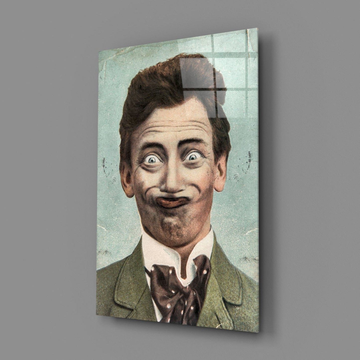 Vintage colored portrait of a man with exaggerated facial expression wearing green jacket and bow tie, printed on glass wall panel.
