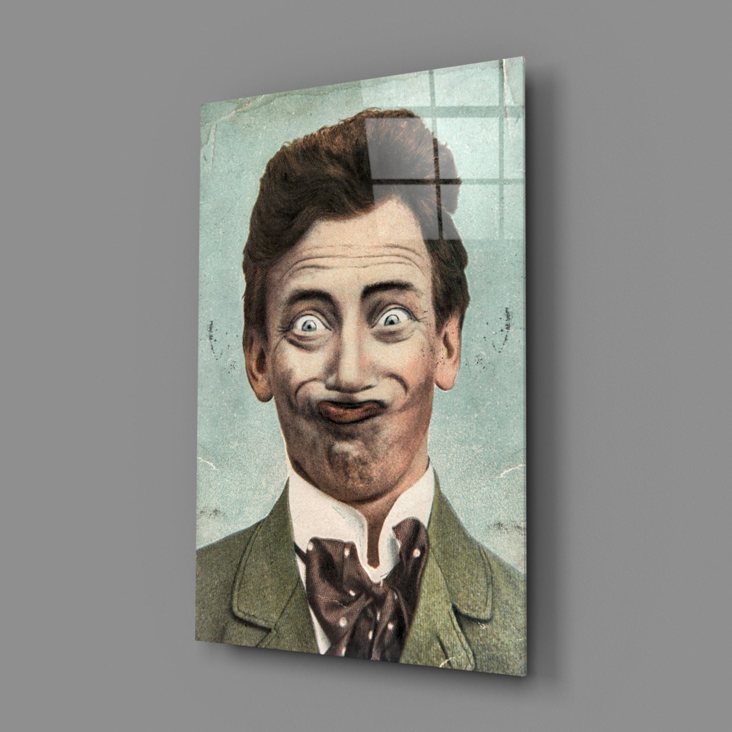 Vintage colored portrait of a man with exaggerated facial expression wearing green jacket and bow tie, printed on glass wall panel.