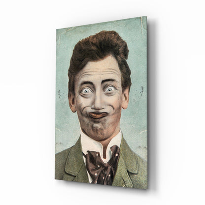Vintage hand-colored portrait of a man with styled brown hair and exaggerated facial expression wearing olive jacket and patterned bow tie on pale blue-green glass panel.