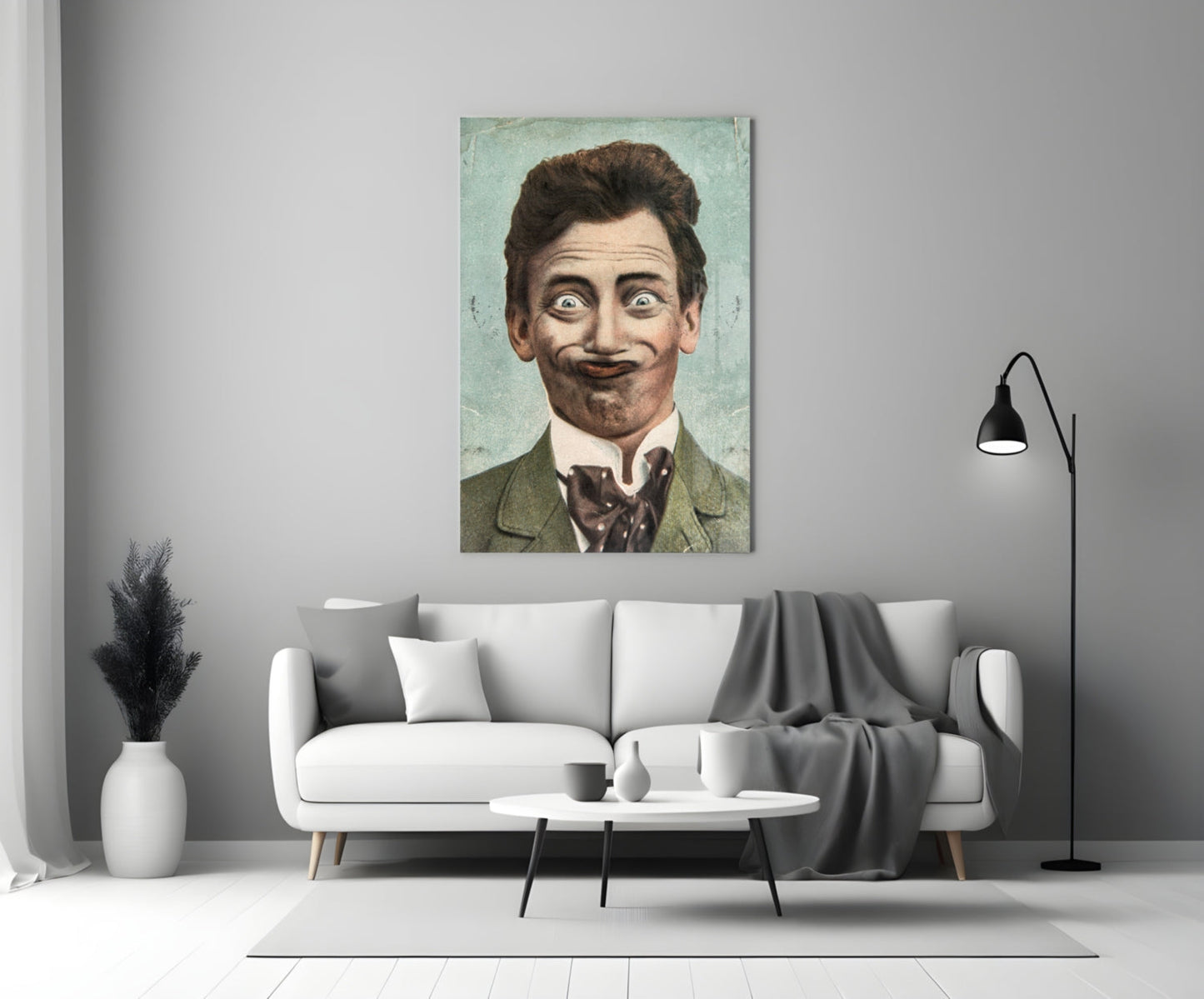 Gentleman Glass Wall Art displaying a vintage portrait of a man with dark hair and mustache wearing a green jacket, hung above a white sofa in a modern living room.
